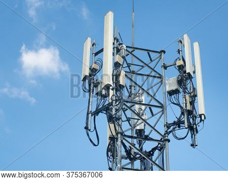 Lte, Gsm, 2g, 3g, 4g, 5g Tower Of Cellular Communication. Telecommunication Tower Against The Blue S