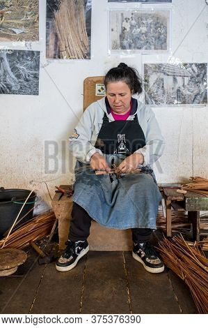 Camacha, Madeira, Portugal - April 19, 2018: A Basket Weaver At Work In The Factory Shop In Camacha 