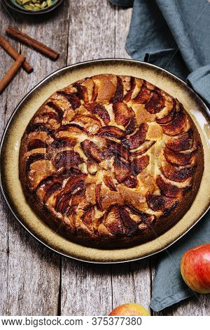 Eplekake. Traditional Norwegian Apple Cake Or Pie Sprinkled Sugar And Cinnamon On Old Rustic Wooden 