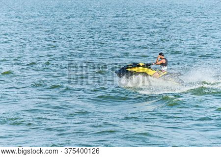 Voronezh, Russia - 23.08.2019 - Man On Water Scooter. Splashes And Drops Around. Summer Vacation On 