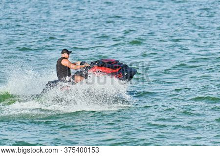 Voronezh, Russia - 23.08.2019 - Man On Water Scooter. Splashes And Drops Around. Summer Vacation On 