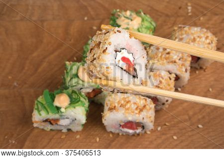 Sushi Rolls On A Wooden Board Delicious Food