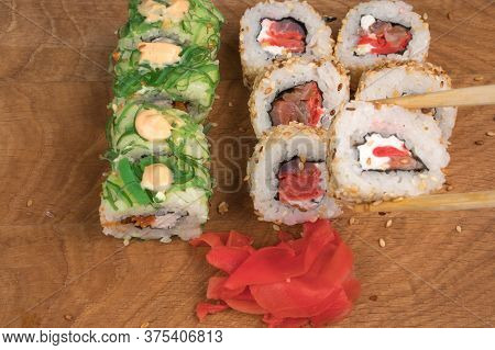 Sushi Rolls On A Wooden Board Delicious Food