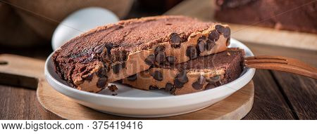 Chocolate Flavor Taiwanese Traditional Sponge Cake (taiwanese Castella Kasutera) On A Wooden Tray Ba