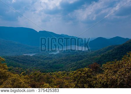 View On Lake And Mountains In Goa, India. By The Road To Surla Waterfall