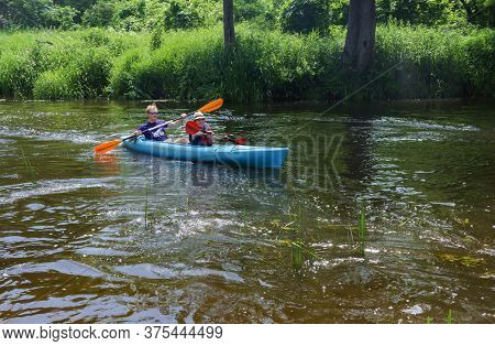 A Man And A Woman Floating On A Kayak, Tourists To Raft On A Canoe On The River, Angrapa River, Kali