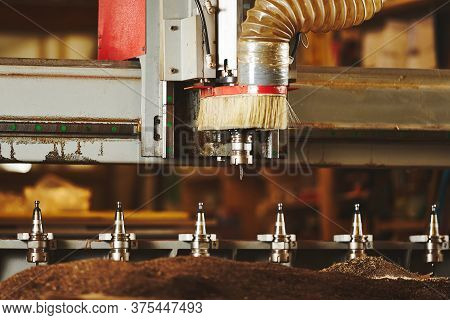 Machine With Numerical Control For Cutting Wood With Various Router Bits.