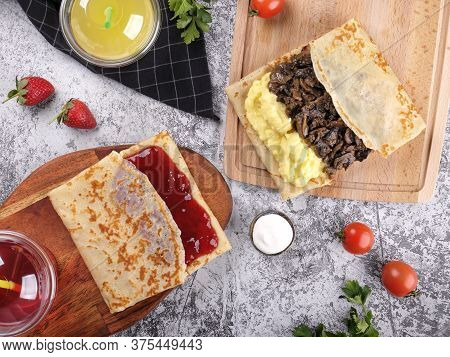 Shrovetide Maslenitsa. Traditional Festival Meal. Pancakes Blini With Meat And Berry Jam, Flat Lay B