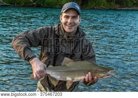 Kitimat, British Columbia, Canada - July 27th, 2015:a Fisherman Holding Up A Large Pink 'humpback' S