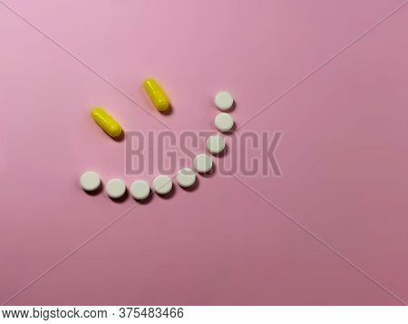 Smile Made Of Pills On An Pink Background. The Concept Of Recovery, Overcoming Depression, Health. P