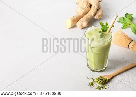 Iced Green Matcha Tea With Ginger On White Table. View From Above.