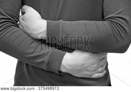 A Man Holds His Stomach Because He Has Diarrhea. Abdominal Pain, Indigestion Due To Poor Nutrition. 