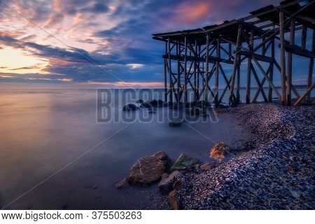 A Beautiful Long Exposure Shot Of A Sunrise Or Sunset By The Black Sea Near A Wooden Pontoon In Tuzl