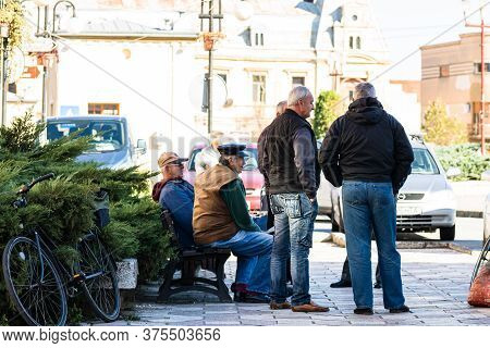 Group Of Old Men Talking In A Park In Lugoj, Romania, 2020
