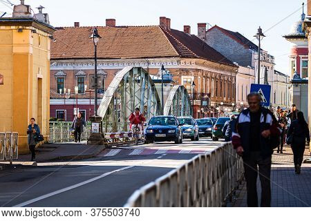 People And Car Traffic In Downtown Of Lugoj, Romania, 2020