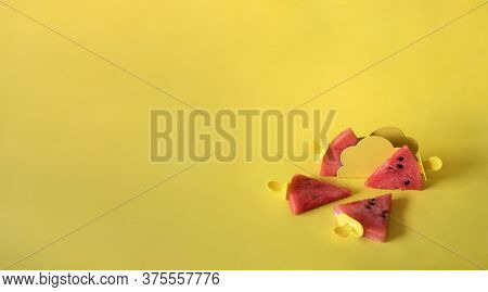 Watermelon Slices On An Ice Cream Stick On A Yelloow Background. Creative Idea Top View