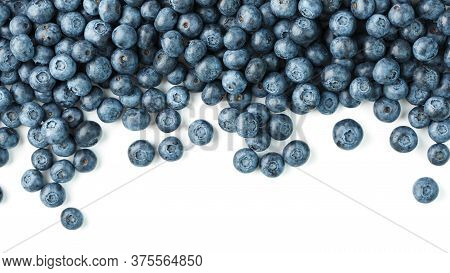 Tasty Blueberries Fruit Are Scattered On A White Background. Frame