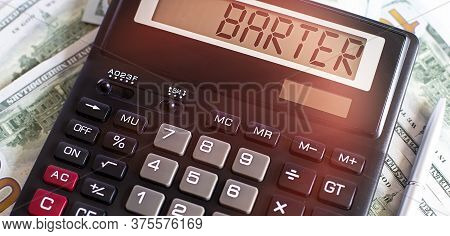 Calculator With The Word Barter On The Display