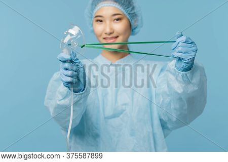 Professional Doctor Woman With A Medical Mask In Her Hands Smiling