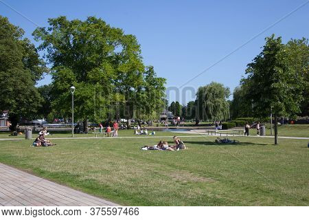 People Relaxing On A Summer Day At Bancroft Gardens In Stratford Upon Avon In Warwickshire In The Uk