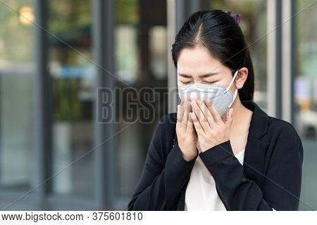 Asian Woman Feeling Sick, Coughing Waering Healthy Face Mark Protect Corona Virus With Outdoor Build