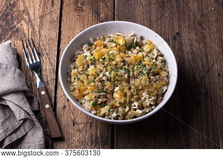 Traditional Middle Eastern Dish, Mujadara Of Lentils, Rice And Fried Onions On Wooden Table, Top Vie