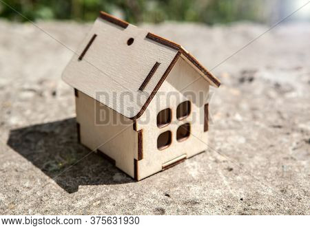 Small Wooden House On Concrete Slab Closeup