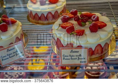 Hossegor, France. 27.06.2020. Delicious Strawberry Cakes In A Bakery Shop Window. Colorful Closeup O