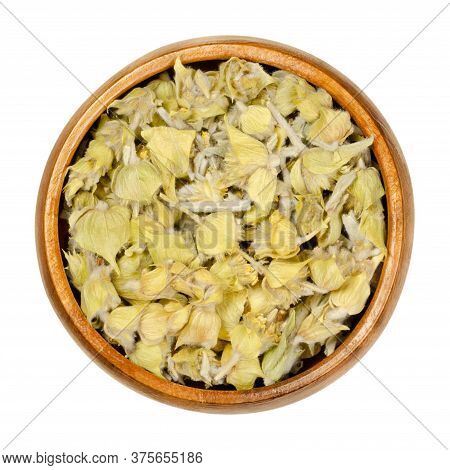 Greek Mountain Tea In Wooden Bowl. Also Known As Ironwort, Sideritis Or Shepherds Tea. Dried Floweri