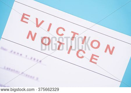 Close Up Of Foreclosed Or Eviction Notice With Blurred Details At Hose.