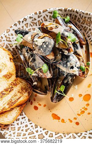 Plate of mussels with creme dubarry in restaurant