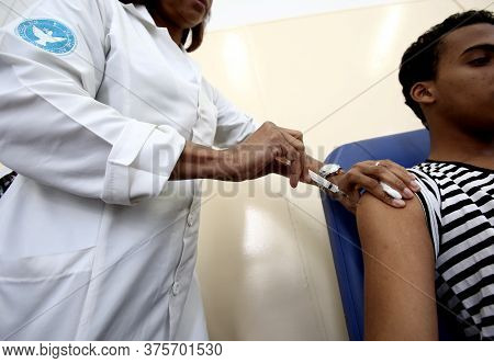Salvador, Bahia / Brazil - September 21, 2017: Young Man Is Seen Receiving Yellow Fever Bill In Publ