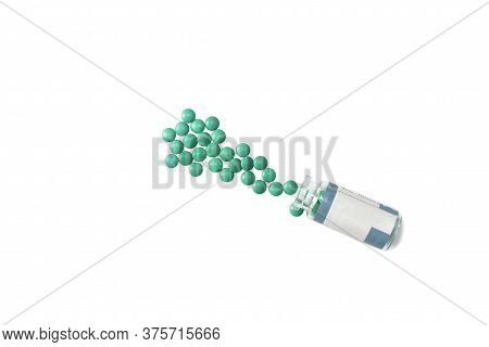 Pills Spilling Out Of Bottle Isolated On White Background. Top View With Copy Space.