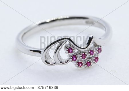 Macro Shot Of A Silver Ring With Pink Nagina Or Stone For Women With White Background