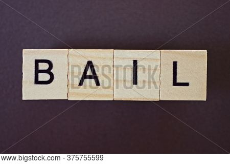Gray Word Bail Made Of Wooden Square Letters On Brown Background