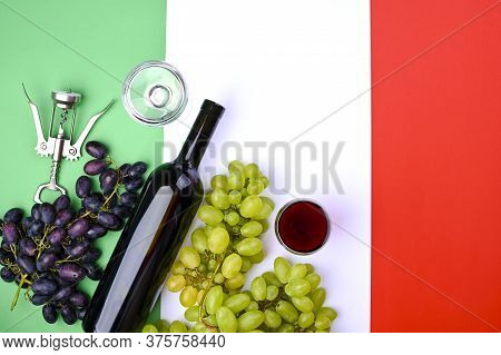 Wine, Grape, Glass Of Wine And Flag Of Italy Close Up. Country Symbol Backdrop. The Concept Of Harve