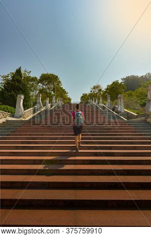 Tourist Walks Up The Stairs To D1 Hill Dien Bien Phu Victory Monument
