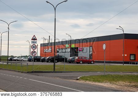 Belarus, Postavy - July 7, 2020: Supermarket And Parking For Cars At Sunset