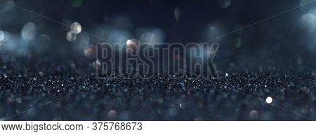 Abstract Dark Blue Background With Blurred Silver Bokeh. Horizontal Background With Short Depth Of F