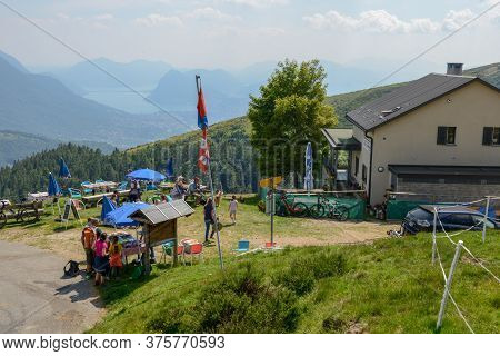 People Eating On A Restaurant On Capriasca Valley Over Lugano On Switzerland