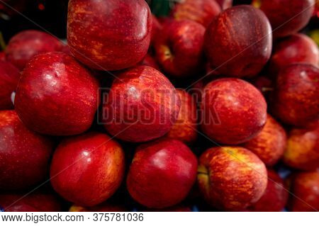 Perfectly Arranged Pile Of Red Apple In Market For Sale. Apples Are Rich In Antioxidants And Helps M