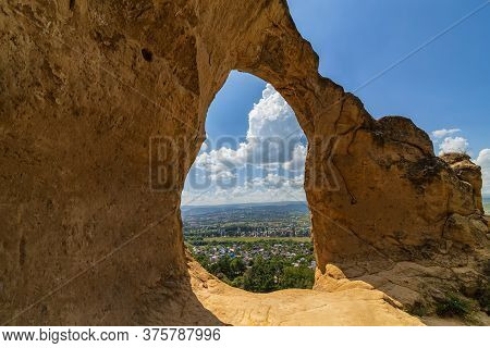 Rock Formations Formed An Arch In The Form Of A Ring On The Top Of The Mountain
