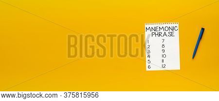 Mnemonic Phrase Concept. Sheet Of Paper On An Orange Background With The Inscription And Place For T