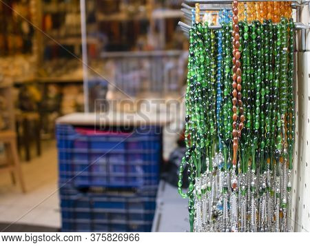 Rosary Hanging On Counter. Assortment Of Different Colors. Symbolizes Islamic Culture. Close Up.