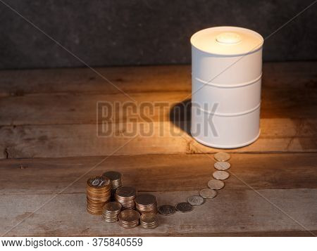 Investing In Oil. Barrel Of Oil And Coins