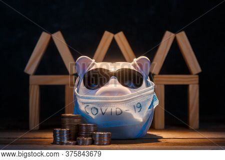 Pandemic Real Estate Crisis. Masked Piggy Bank