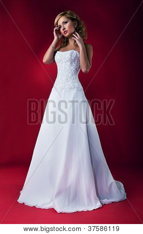Beautiful Fiancee Blonde In White Nuptial Dress Posing