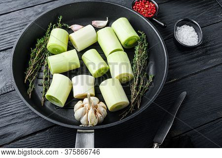 Raw Leeks Sultan  Chopped Oninon On Grill Pan Uncooked With Herbs Ingredients , On  Black Wooden Tab