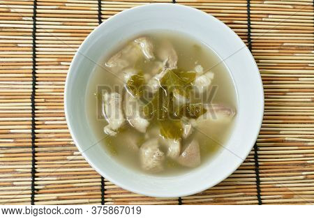 Boiled Pork Leg And Belly With Cowa Leaf Soup On Bowl