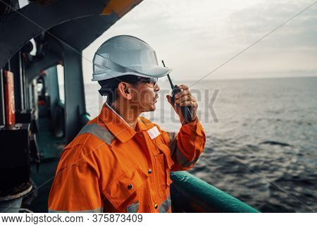 Filipino Deck Officer On Deck Of Vessel Or Ship , Wearing Ppe Personal Protective Equipment